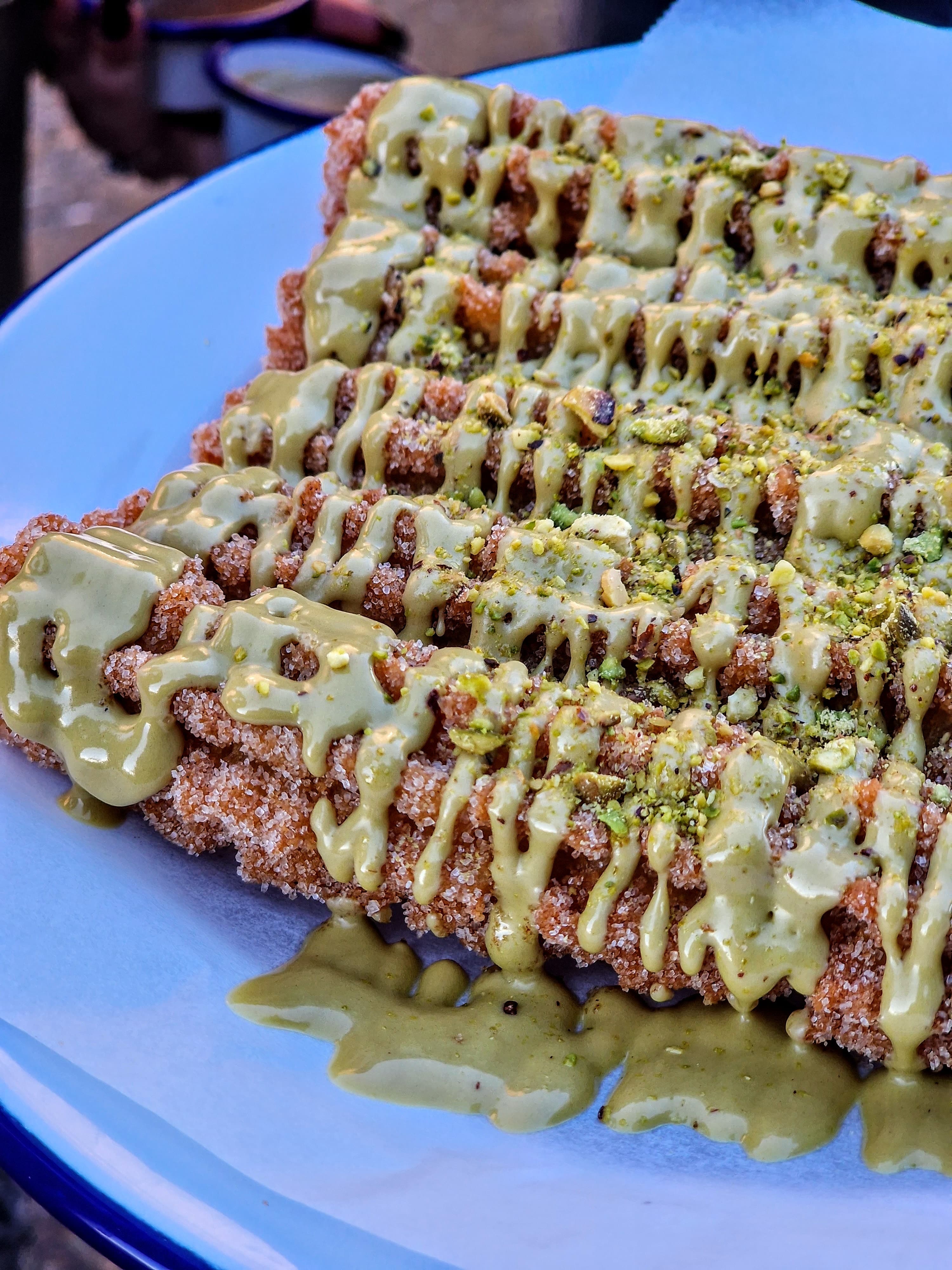 Young diverse couple having lunch with junk food